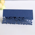 Elegant navy blue laser-cut place card with intricate leaf patterns for wedding seating - Sapphire Blue
