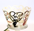 Golden laser-cut cupcake wrapper featuring hollow heart patterns and artistic Love lettering - Reflective Silver