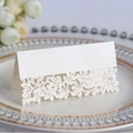 White pearlescent name place card with intricate laser-cut floral design for table settings - Ivory