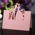 Pink laser-cut wedding place card with bride and groom silhouette and hollow floral design - Pink