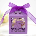 Detail of laser cut purple owl candy box with an elegant ribbon bow for party favors - Dark Purple