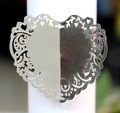 Macro detail of laser-cut lavender heart napkin ring with intricate floral lace pattern - Reflective Silver