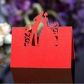Elegant red laser-cut wedding place card with a bride and groom silhouette design - Red