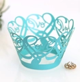Macro detail of laser-cut Love hearts pattern on light blue pearlescent cupcake wrappers - Tiffany Blue