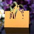 Elegant gold laser-cut wedding place card with bride and groom silhouette design - Gold