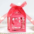 Detail of laser-cut pumpkin carriage candy box with elegant organza bow and crown - Pearlescent Red