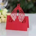 Elegant laser-cut red peacock place card for wedding table with intricate hollow design - Pearlescent Red
