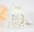 Detail of laser-cut white rose gift box featuring a sheer ribbon and delicate paper texture - Ivory