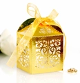 Close-up of golden laser-cut wedding favor box with elegant European floral patterns - Reflective Gold