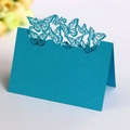 Cyan laser-cut butterfly place card for wedding tables in a folded standing position - Sky Blue