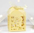 Detailed laser-cut yellow gift box with rose pattern and ivory ribbon bow on top - Gold