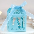Detail showing laser-cut wedding silhouette on light blue gift box with satin ribbon bow - Tiffany Blue