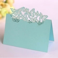 Elegant light blue place card with intricate laser-cut butterfly design for weddings - Pearl Pale Blue