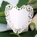 Elegant laser cut white heart shaped napkin ring with intricate lace patterns - White