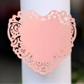 Laser-cut pink heart napkin ring holder with elegant hollow floral pattern detail - Pink