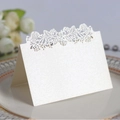 Elegant white pearlescent paper table card with laser-cut rose design for weddings - Ivory
