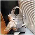 Silver hollow geometric bucket bag with a cute plush bear charm and thin shoulder strap - Silver (With Pendant)