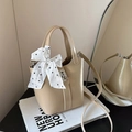 Beige bucket bag with silver hardware lock and polka dot silk scarf decoration - Khaki