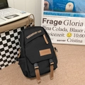 Black lightweight nylon crossbody bag with brown straps and buckle closure - Black
