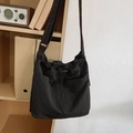 Large black nylon drawstring bucket bag with pleats and functional front pockets - Black