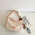 Minimalist beige nylon crossbody bag with red zipper trim and adjustable strap - No Pendant / Off White