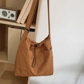 Caramel nylon bucket bag with drawstring closure and large front pockets in a casual style - Caramel color
