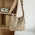 Beige khaki large nylon drawstring crossbody bucket bag with dual front utility pockets - Khaki