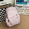 Bolso de pecho minimalista color lila con correa ajustable y parches de marca - Morado