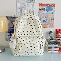 White canvas backpack with black star print and plush charm for casual student use - Black Star With Pendant