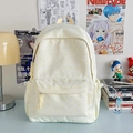 Cream canvas backpack with yellow star print and side logo tag on aesthetic desk - Yellow Star Without Pendant