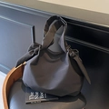 Minimalist black tote bag featuring large stylish bow shoulder straps for commute - Black