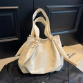 Minimalist cream white tote bag featuring large capacity and unique knotted strap detail - Off-white