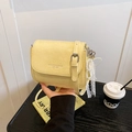 Pale yellow wrinkled leather crossbody phone bag with pearl bow and heart charm details - Yellow with Pendant