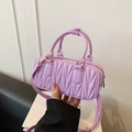 Lavender quilted leather crossbody bag with pleated texture and adjustable strap - Purple