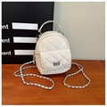 Macro detail of quilted cream white mini backpack showing glossy texture and chain strap - White