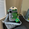Gray and green plaid bicycle handlebar water bottle bag with floral charm accessory - With Charm / Green