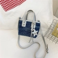 Mini navy polka dot denim bucket bag with silver trim and star charm detail - Dark Blue With Pendant
