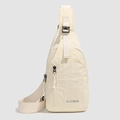 Minimalist cream white crossbody chest bag with adjustable strap and front zipper - Beige