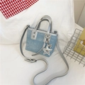 Light blue denim bucket bag with silver glitter star pendant and long strap - Light Blue With Pendant
