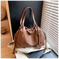 Brown pleated leather bucket bag with heart pendant and branded shoulder strap - Brown