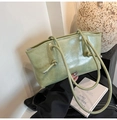 Chic sage green faux leather tote bag with unique knotted thin handles and metal zipper - Green