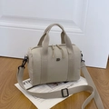 Minimalist beige nylon Boston bag with double handles and adjustable crossbody strap - Gray