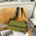 Army green cylindrical crossbody bag in durable canvas with wide black shoulder strap - Green