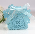 Detailed view of light blue laser-cut flower candy box with matching ribbon bow - Pearl Pale Blue