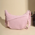 Detail of light pink corduroy crescent bag showing vertical texture and zipper puller - Pink