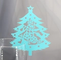 Close-up of light blue laser-cut Christmas tree place card on wine glass rim - Tiffany Blue