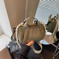 Olive green drawstring bucket bag with thick woven handle and branded logo detail - Army Green