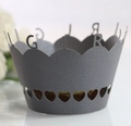 Macro detail of laser-cut cupcake wrapper featuring GIRL lettering and heart patterns - Silver Charcoal