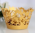 Elegant gold laser-cut lace cupcake liner with intricate vine pattern for party decor - Gold