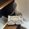 Metallic silver crossbody bag with front pockets and decorative ribbon bows in chic style - Silver